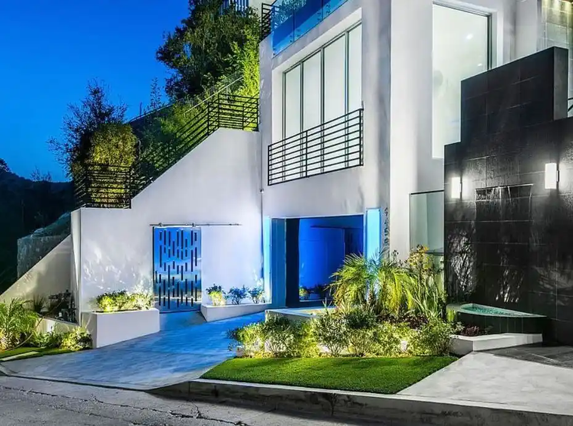 Bel Air entry court illuminated at night