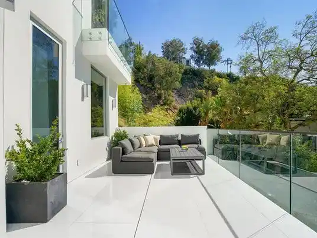 Bel Air balcony lounge with planted hillside view