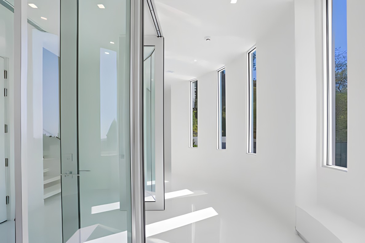 Bel Air upper hall with glass partitions and vertical slot windows