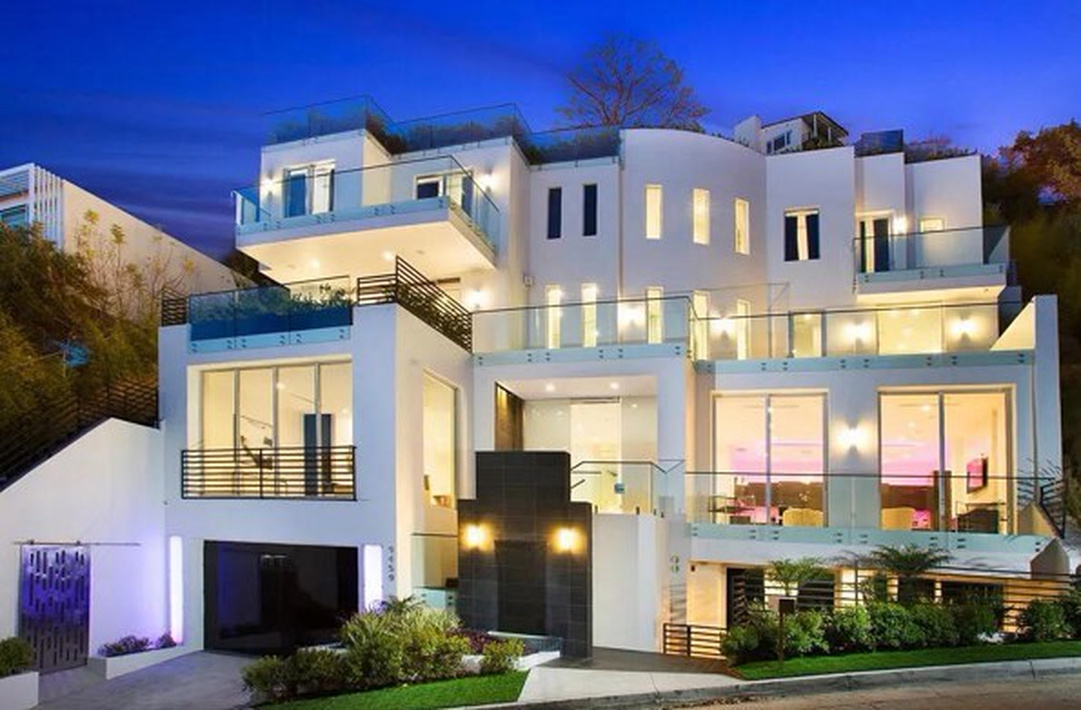 Bel Air residence front elevation at dusk with lit terraces and glass railings