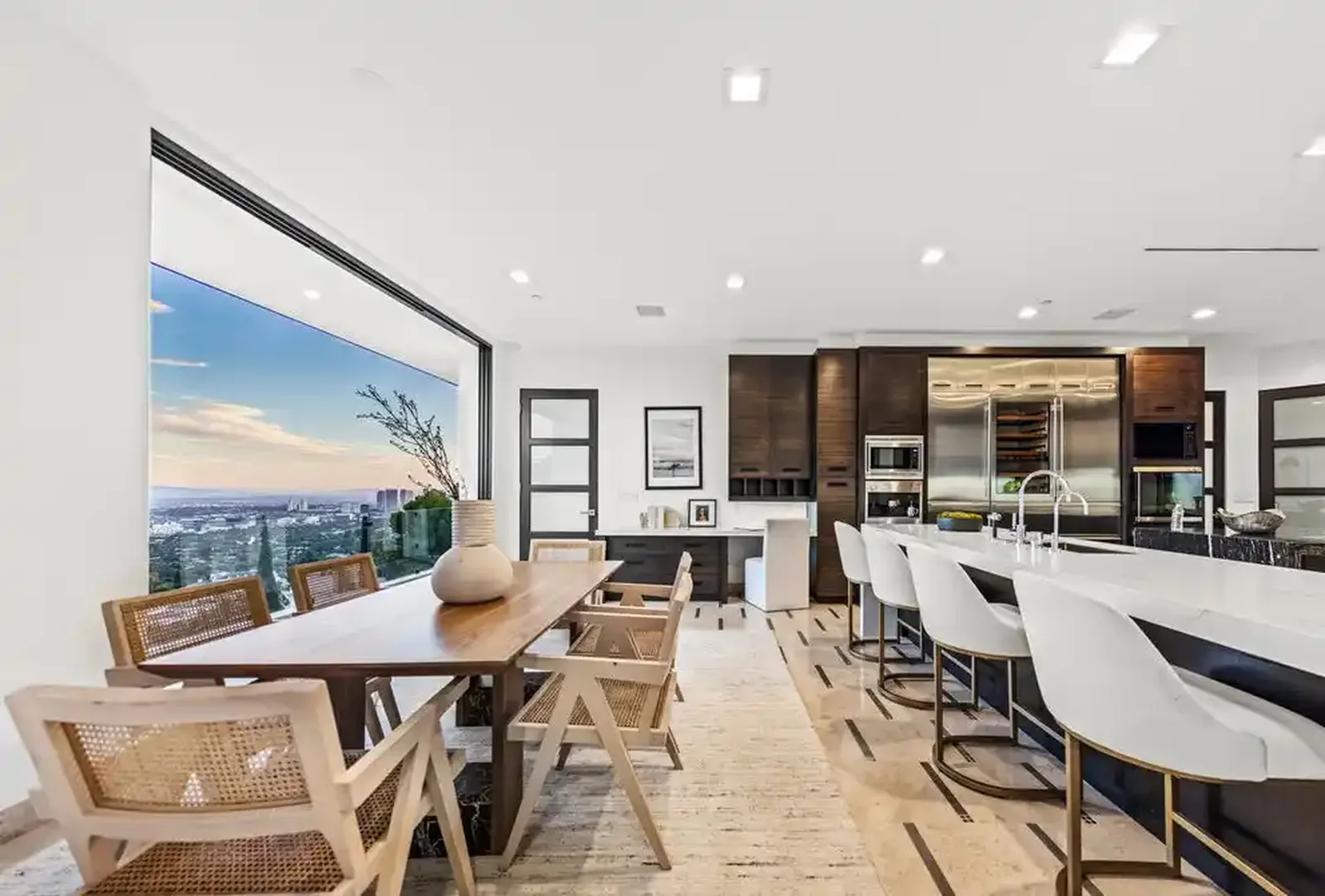 Open dining and kitchen area with panoramic view windows