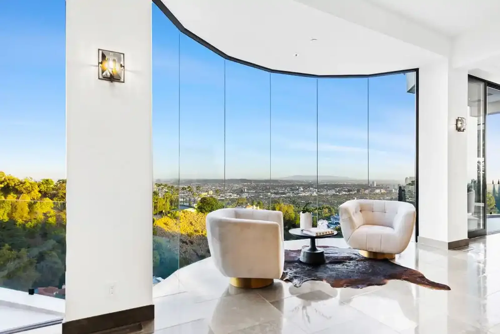 Curved glass living room overlooking Los Angeles