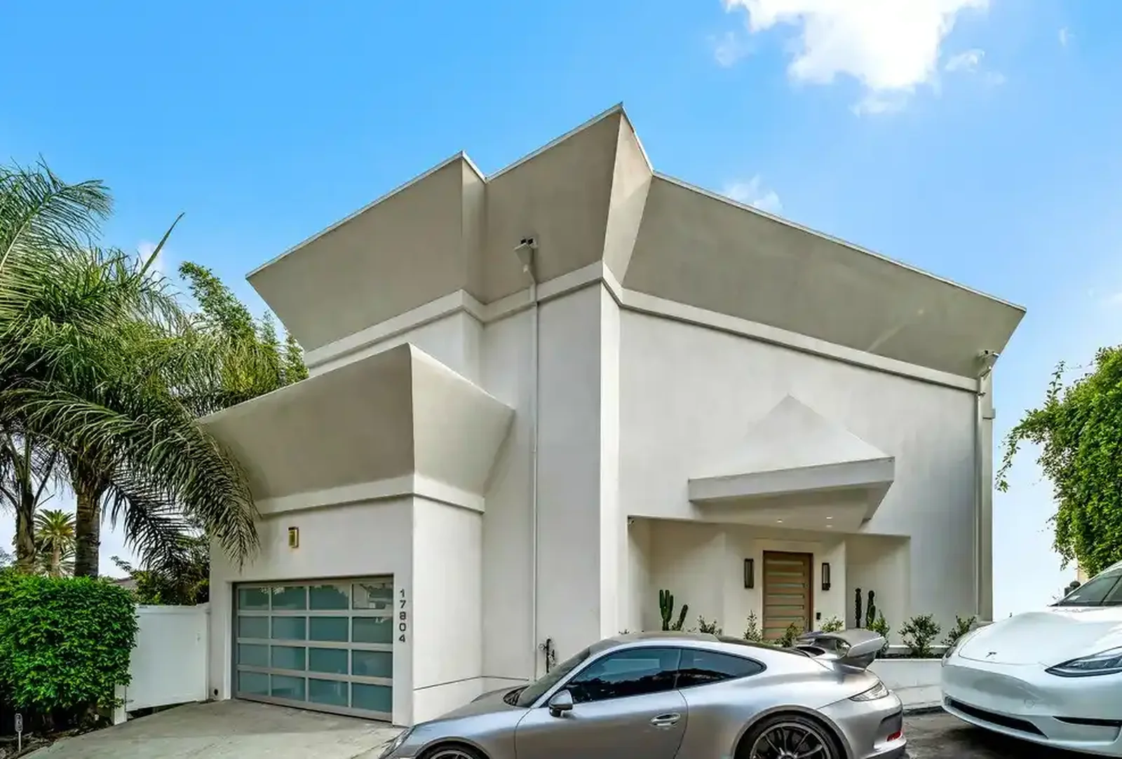 Mediterranean residence with motor court and sculpted stucco forms