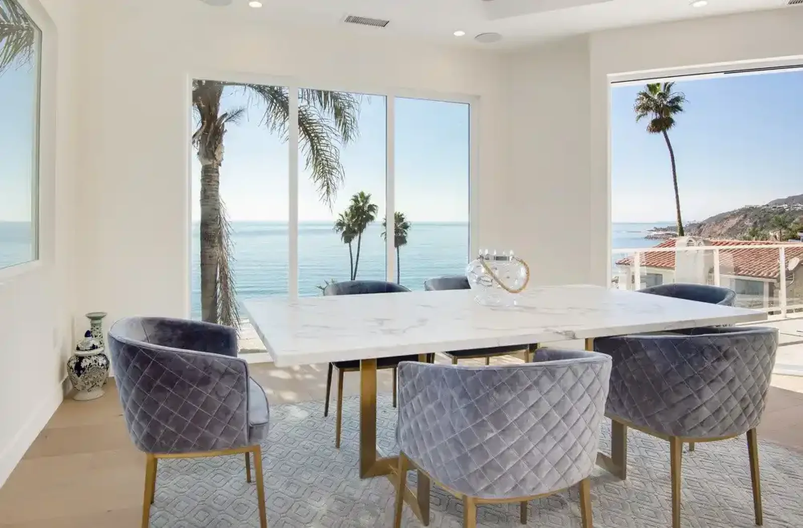 Dining room with ocean views through full-height glazing