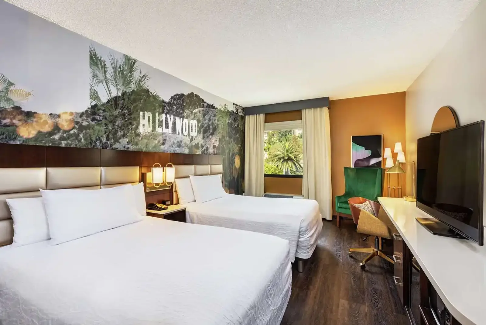 Hotel guest room with mural headboard wall