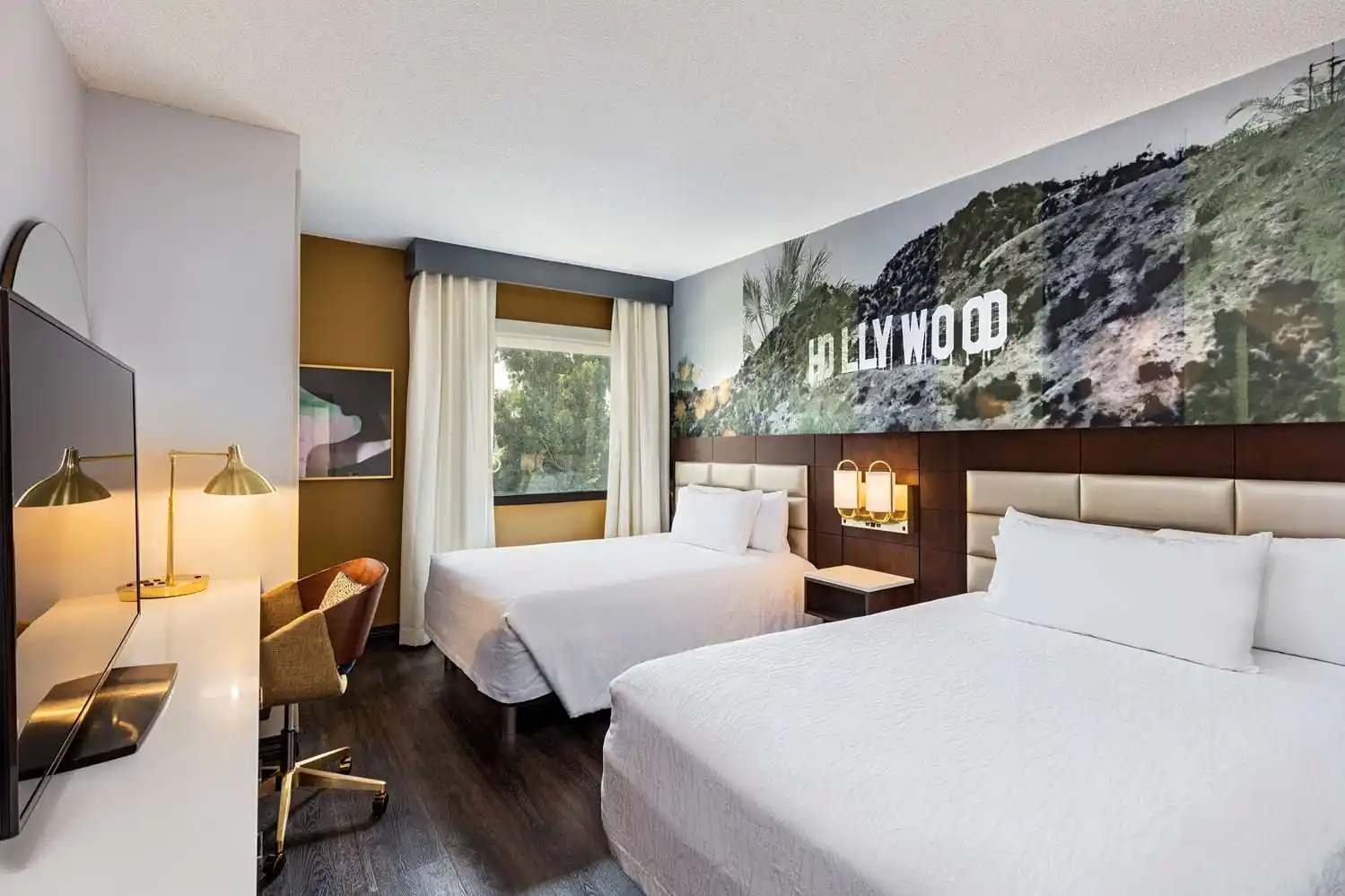 Hilton Garden Inn guest room with Hollywood mural