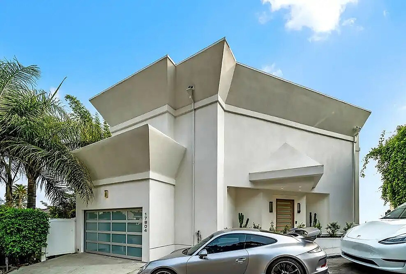 Contemporary two-story residence exterior with garage forecourt