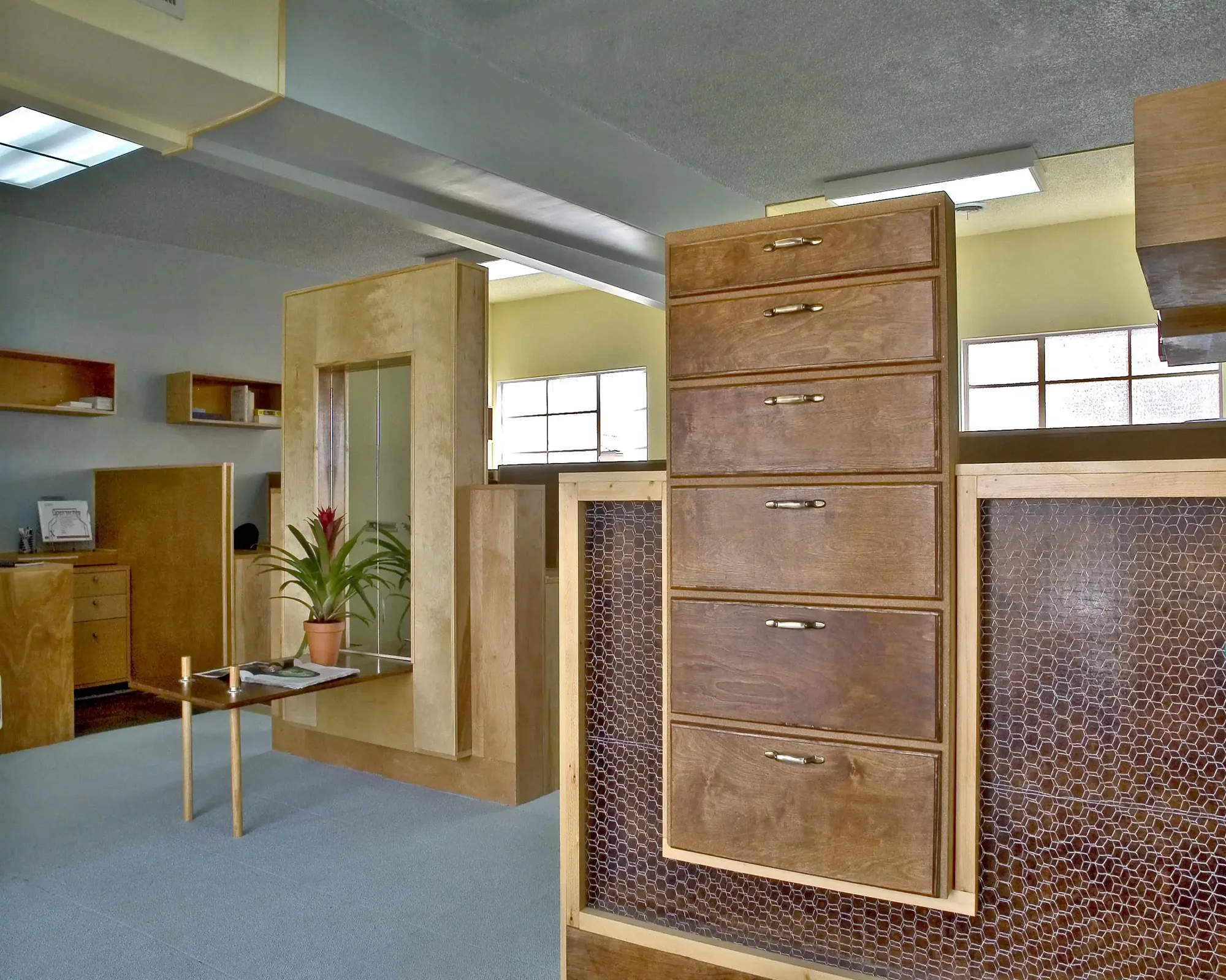 Custom timber millwork reception feature in a commercial interior