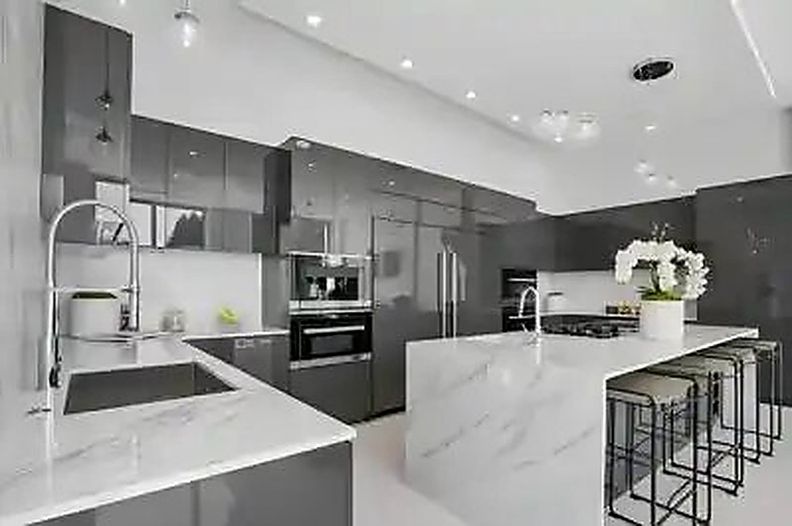 Remodelled kitchen with stone island and integrated appliances
