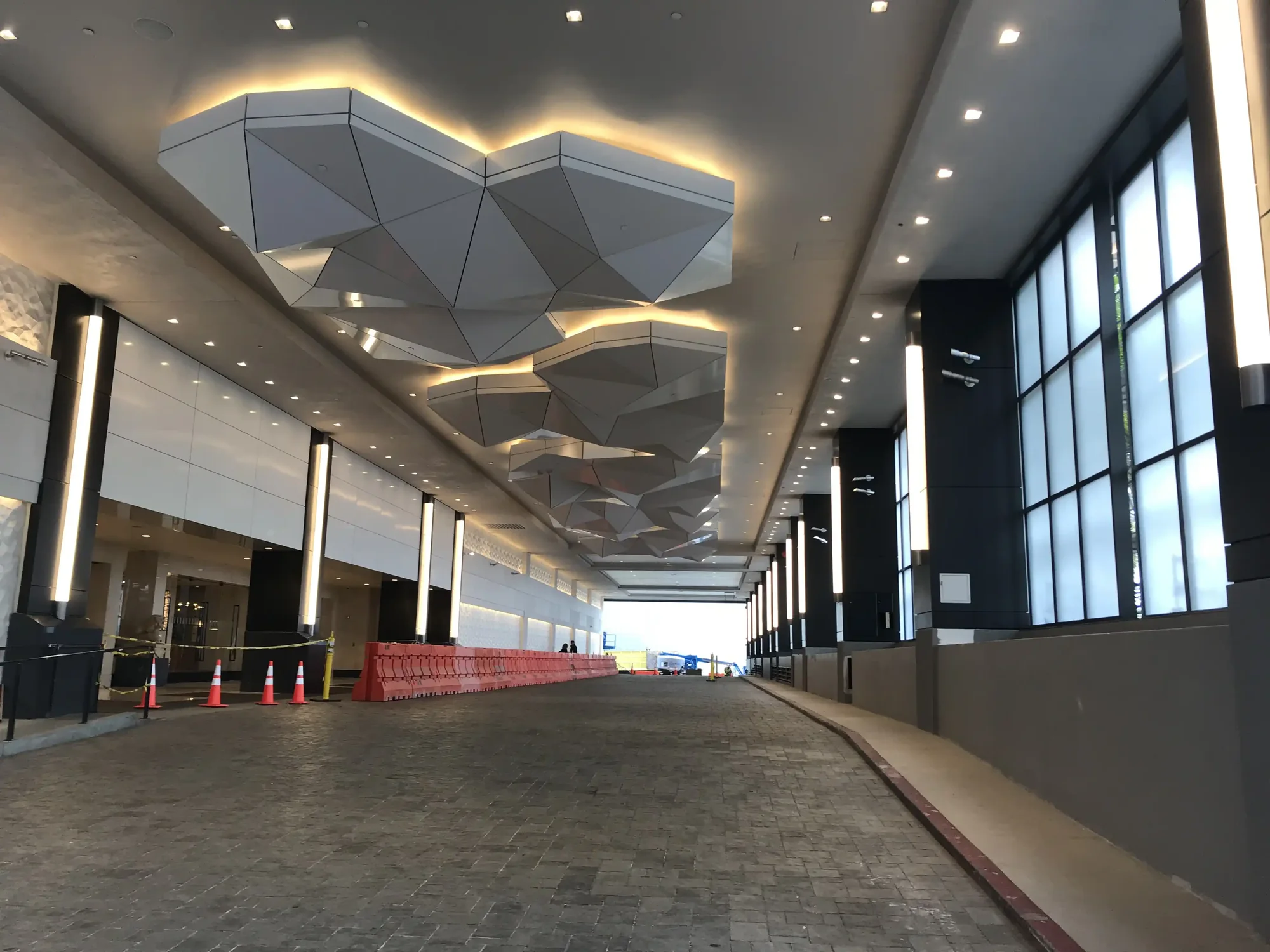 Faceted ceiling panel system installed during hotel renovation