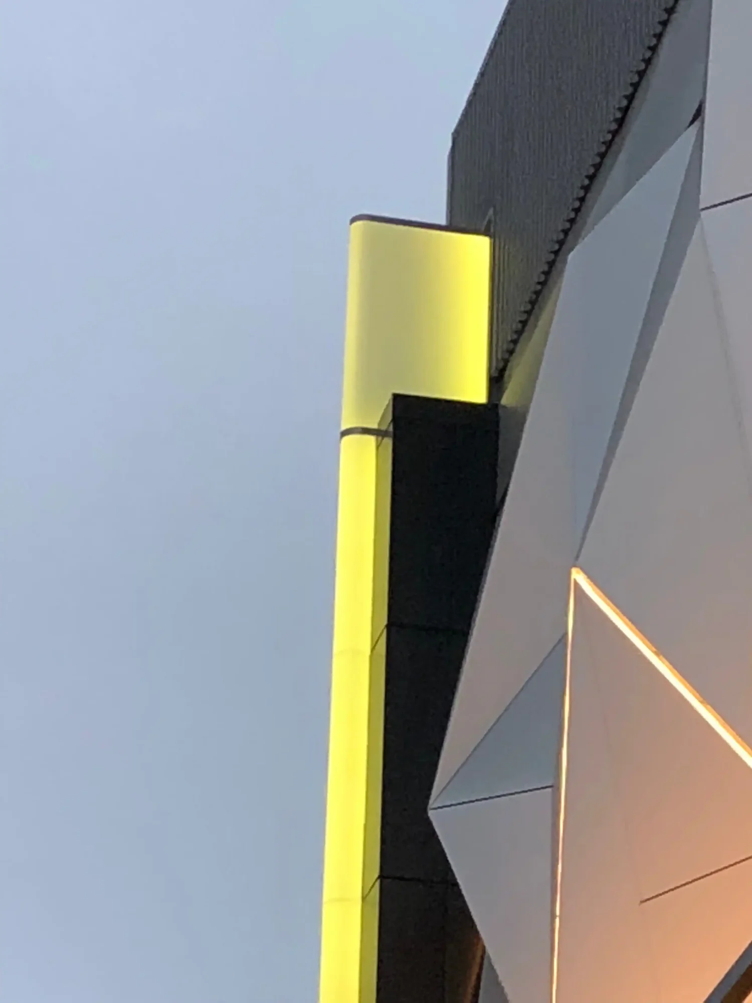 Exterior facade detail with yellow accent fin