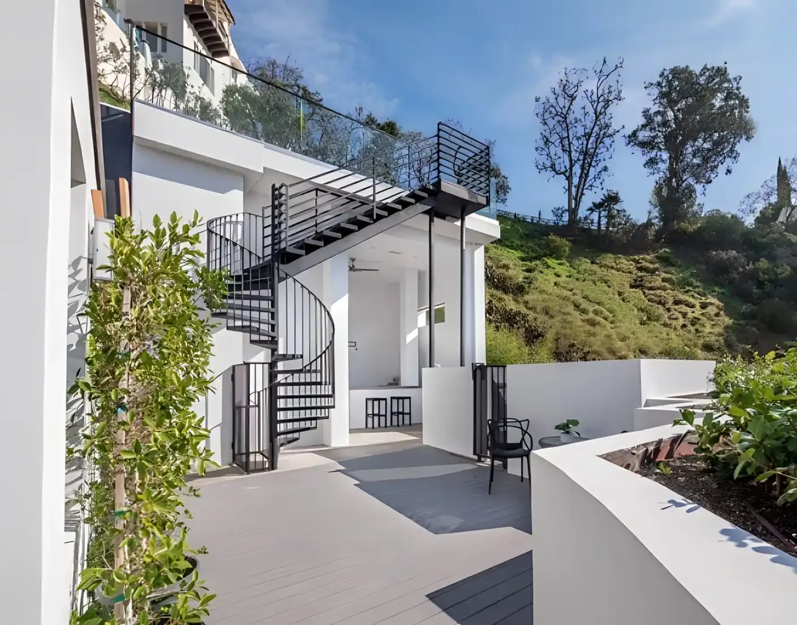 Modern coastal residence with exterior stair and planted terrace