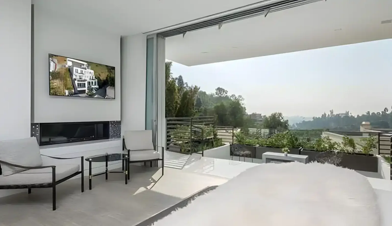Living room opening to a view terrace through sliding glass
