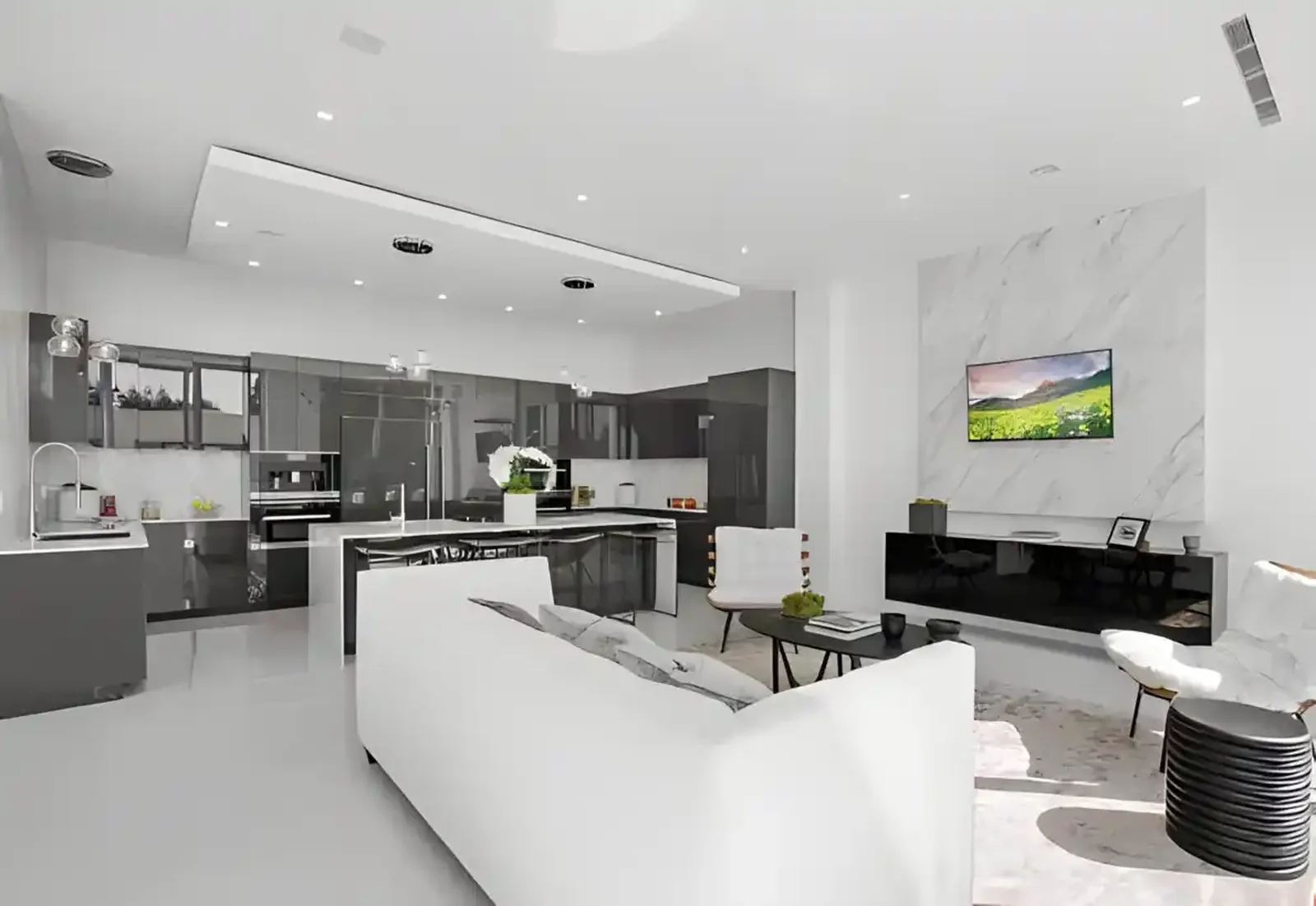 Open kitchen and living area with stone island
