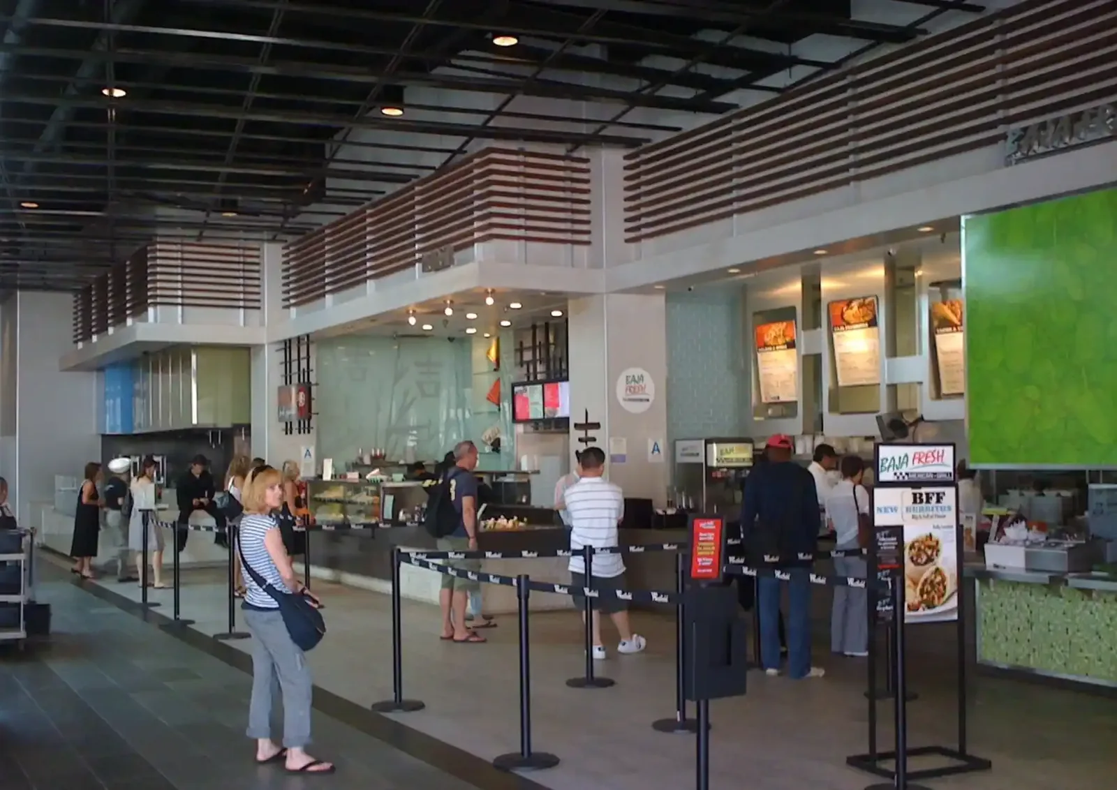 Shopping centre food hall with queueing customers
