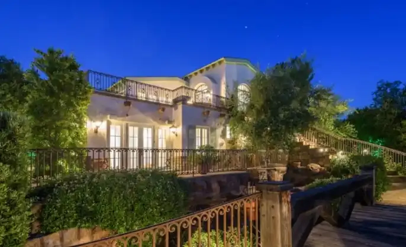 Torreyson hillside residence exterior lit at night above the street
