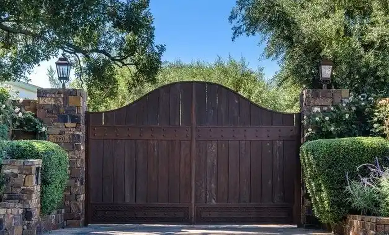 Torreyson wood entry gate between stone walls