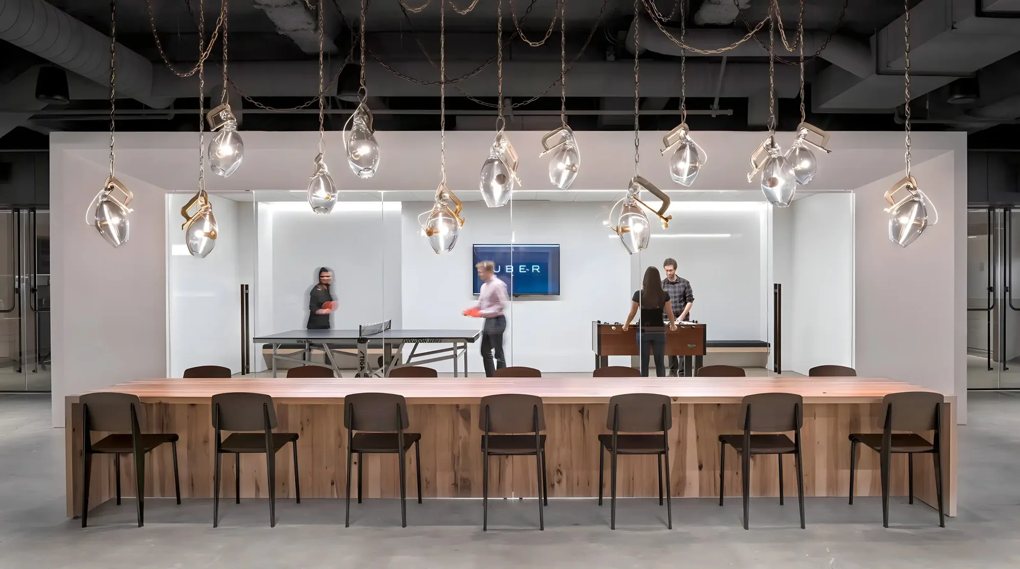 Office cafe bar with counter seating and pendant lights