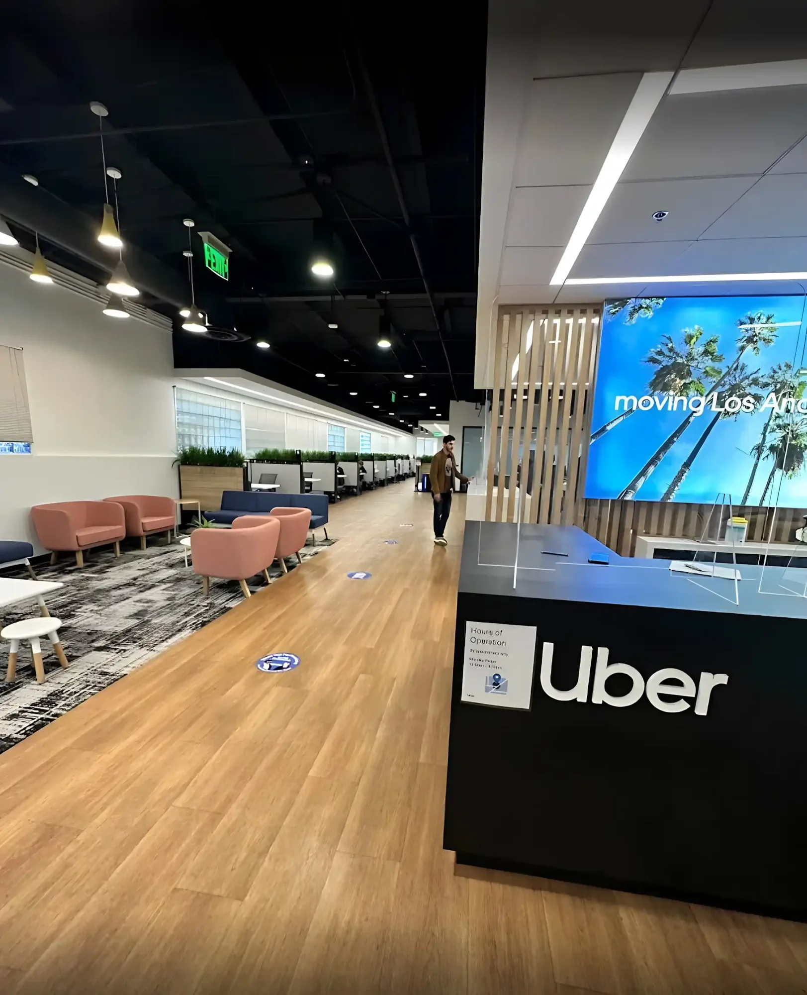Office reception with branded desk and video wall